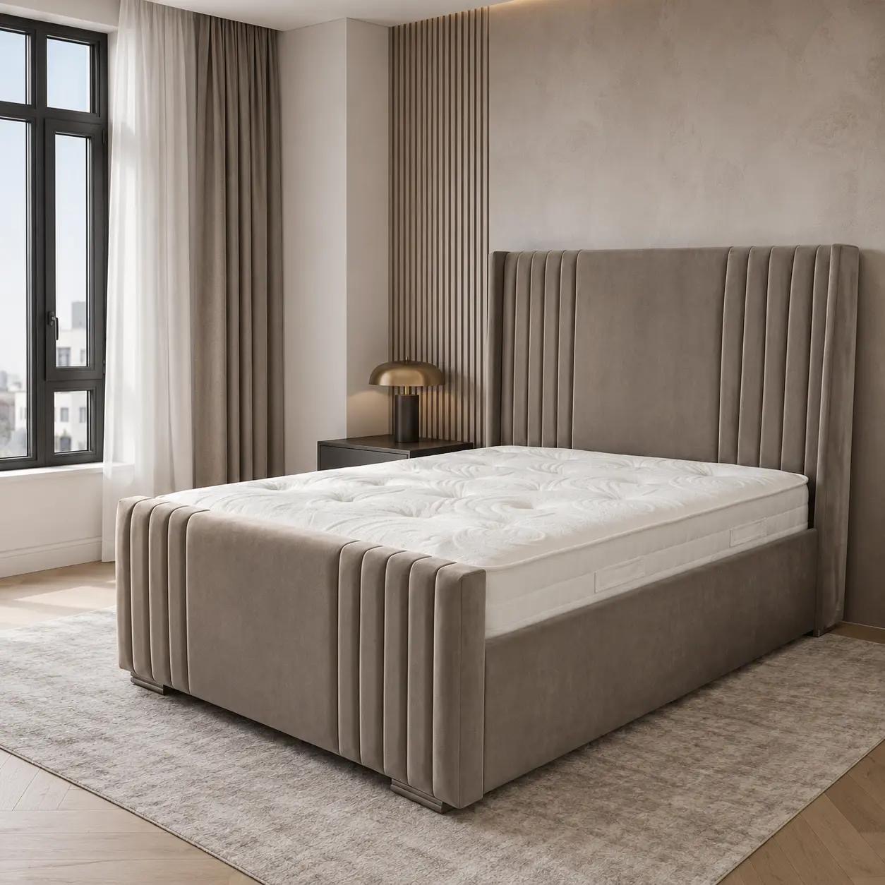 Neutral upholstered bed with vertical detailing at the head and foot.