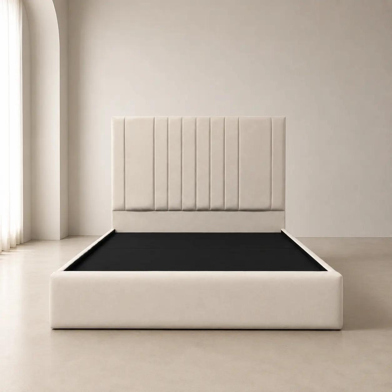 Light upholstered bed frame with a plain footboard and a vertically lined headboard.